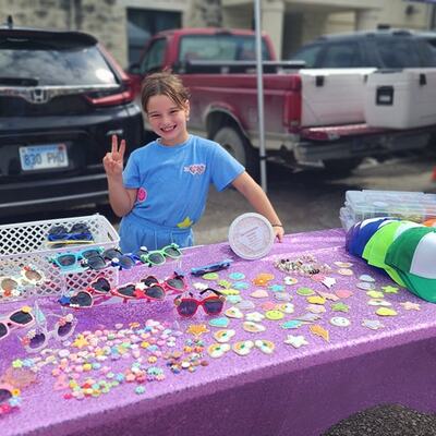 Alvy selling sunglasses and make your own trucker hat bar.