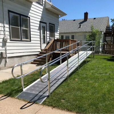 Aluminum ramp leading to a front door of a residence