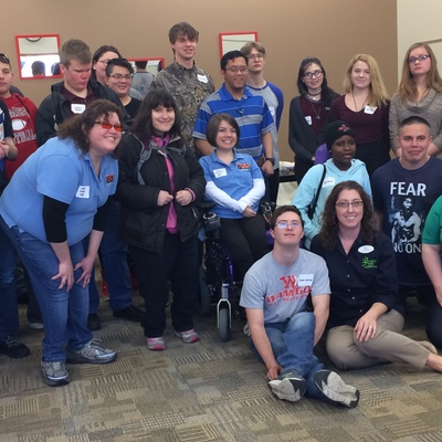 High school students with various disabilities take a photo break with their employment mentors.