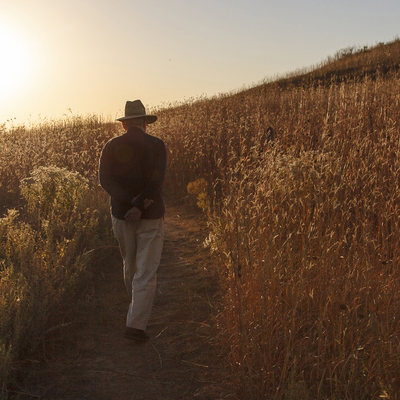 A visitor enjoys the Park's tallgrass prairie in the fall