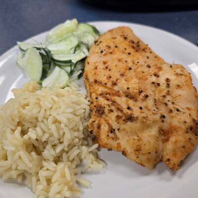 Grilled chicken, rice, cucumber salad.
