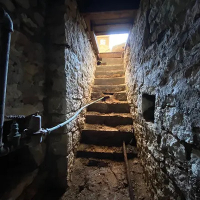 Current steps to stone arched cellar underneath museum